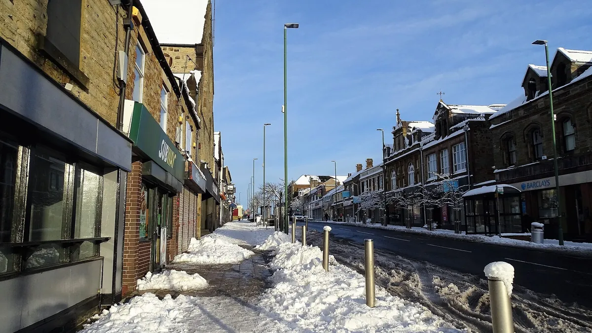 Front Street in Consett in the snow. Photograph by Robert Graham, CC BY-SA 2.0.