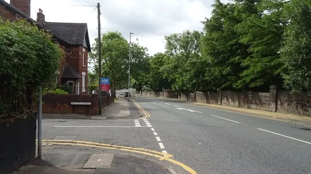 Hanley Road in Smallthorne, Stoke-on-Trent, with the street sign on a brick wall. The roundabout railings are not in the picture.