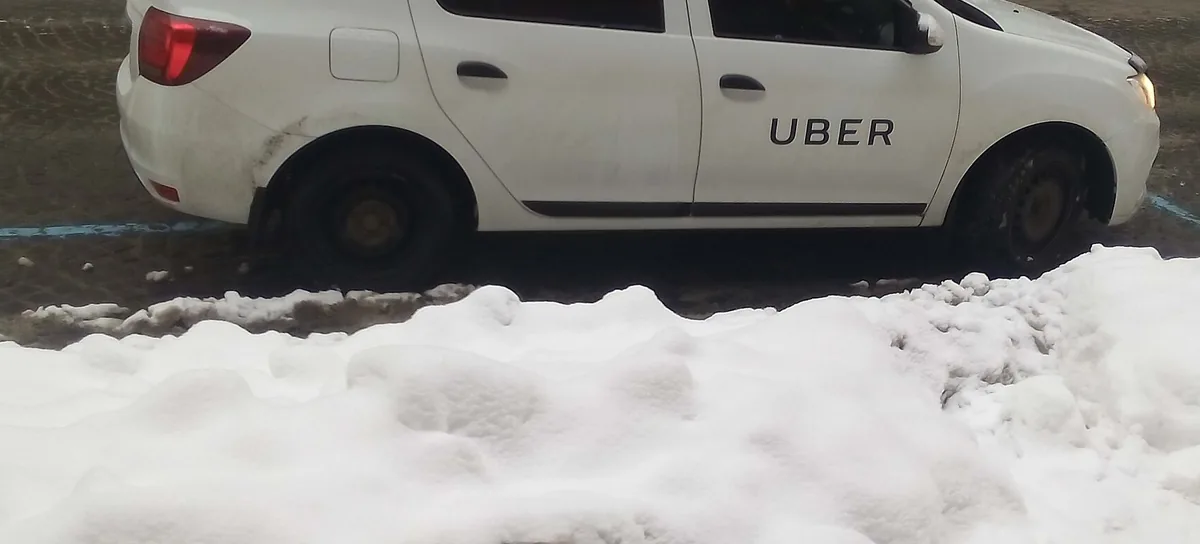A white car with Uber on the door, in Kyiv. Photograph by Nickispeaki, CC BY-SA 4.0.