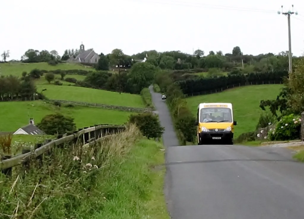 Yellow school bus on a rural Northern Ireland road Yellow school bus on a rural Northern Ireland road