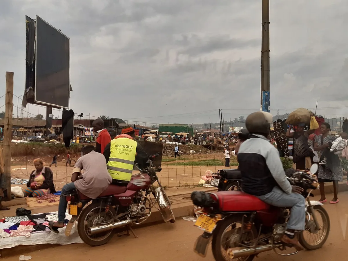 Boda-boda motorcycle taxis on a busy street in Uganda