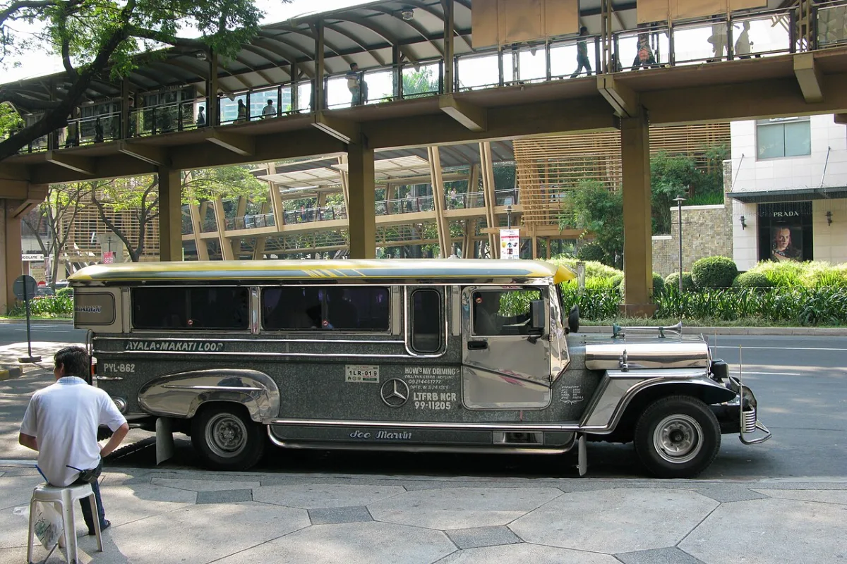Chrome Manila jeepney with Ayala-Makati Loop markings parked at the kerb