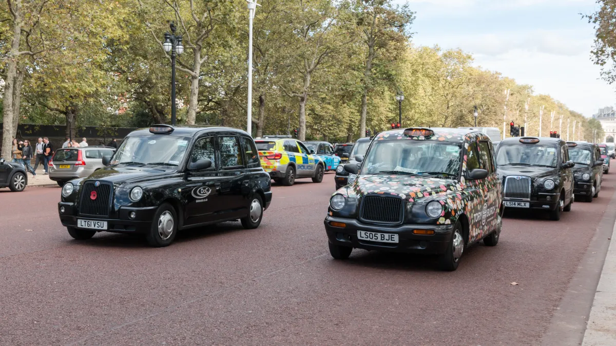 Black cabs in traffic on The Mall in London,