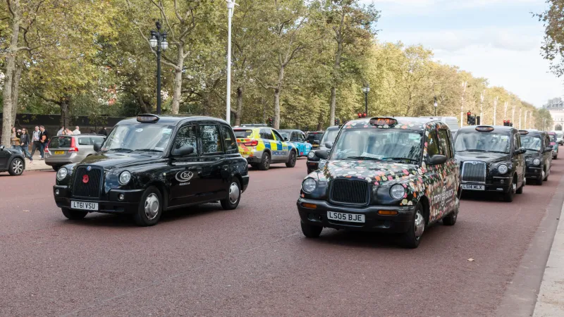 Black cabs in traffic on The Mall in London,