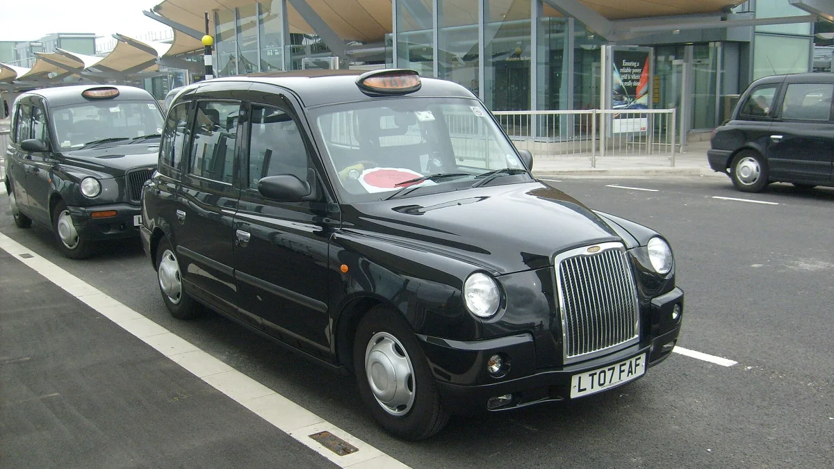 Black cabs waiting at a UK taxi rank